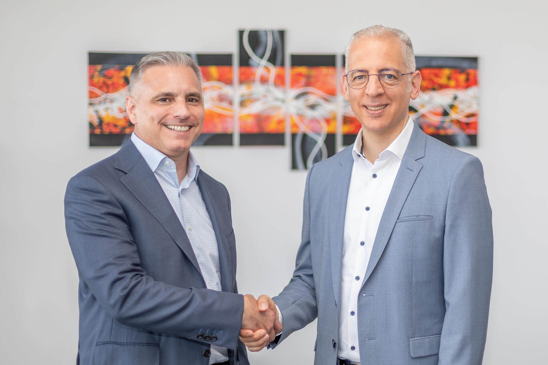 CEO Roland Schreiner (right) welcomes Brian Zumbolo as the new President of Schreiner Group LP.