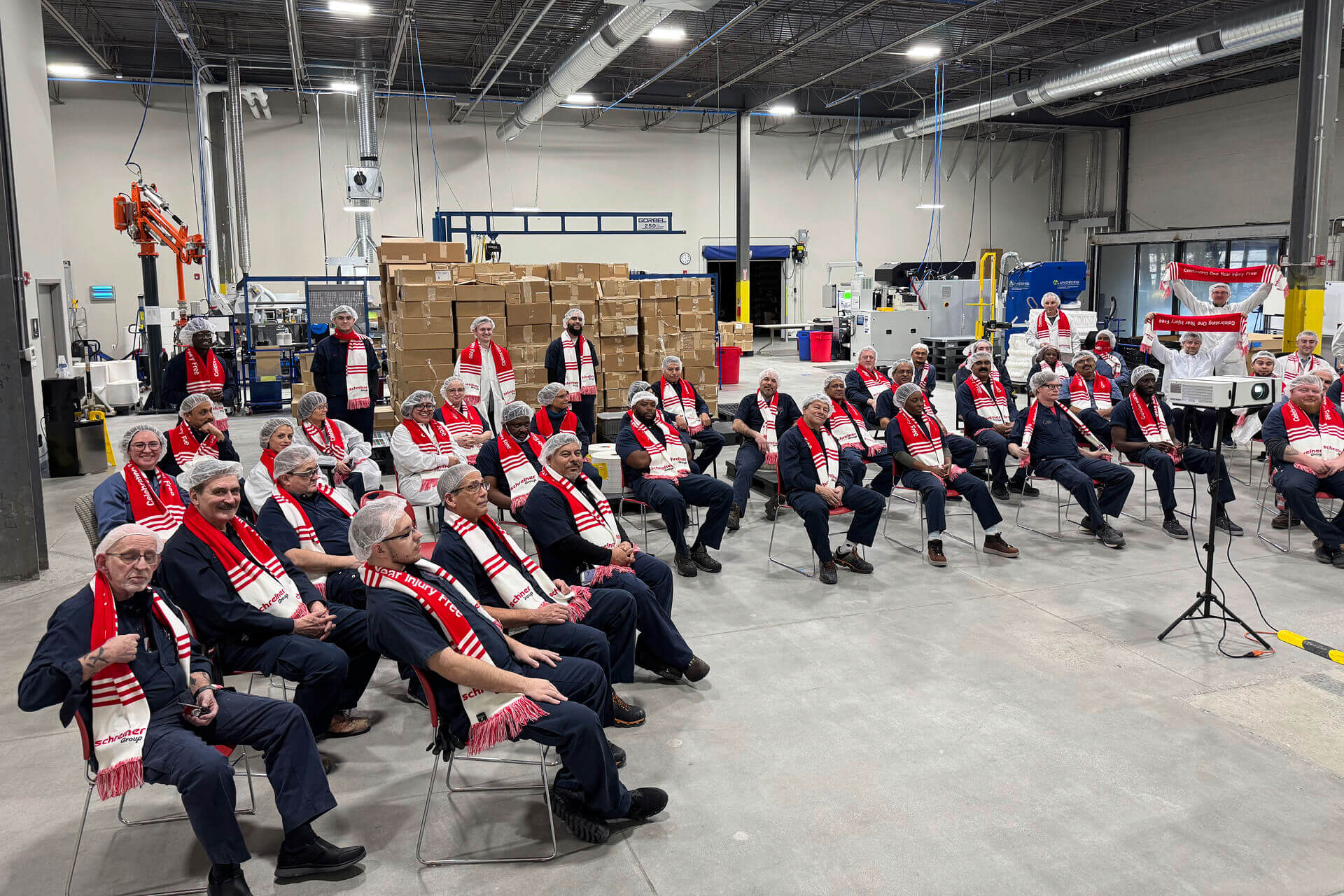 During a ceremonial event, employees were honored for their responsible behavior and received scarves to celebrate the accident-free year.